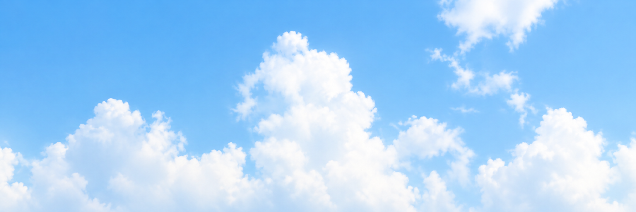 Soft white clouds in a clear blue sky